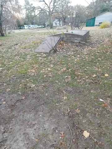 a view of a yard with an outdoor space