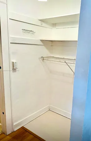 a view of a room with racks on the wall