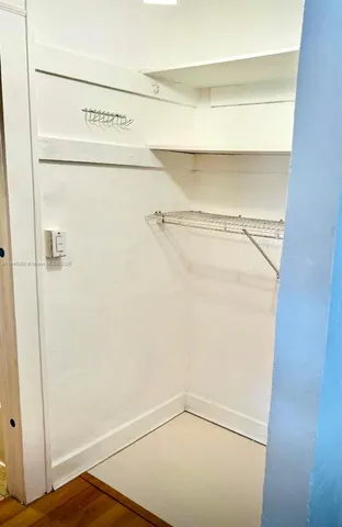 a view of a room with racks on the wall