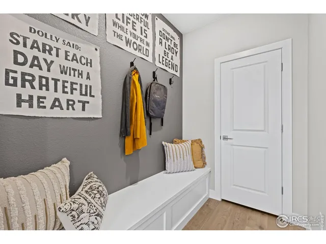 a view of a dining room with furniture and a window