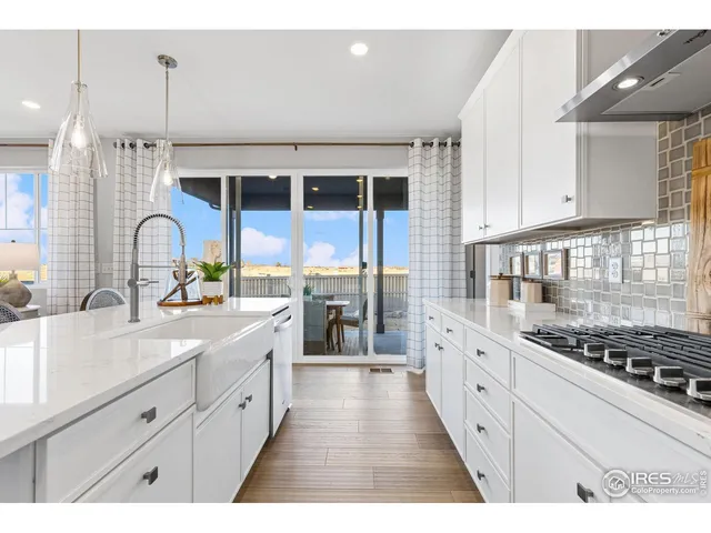 a kitchen with kitchen island appliances and wooden cabinets