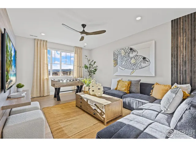 a kitchen with stainless steel appliances kitchen island granite countertop a lot of cabinets and wooden floor