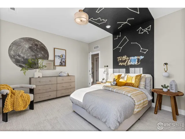 a bedroom with a bed dresser and window