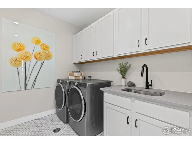 a view of a workspace with furniture and wooden floor