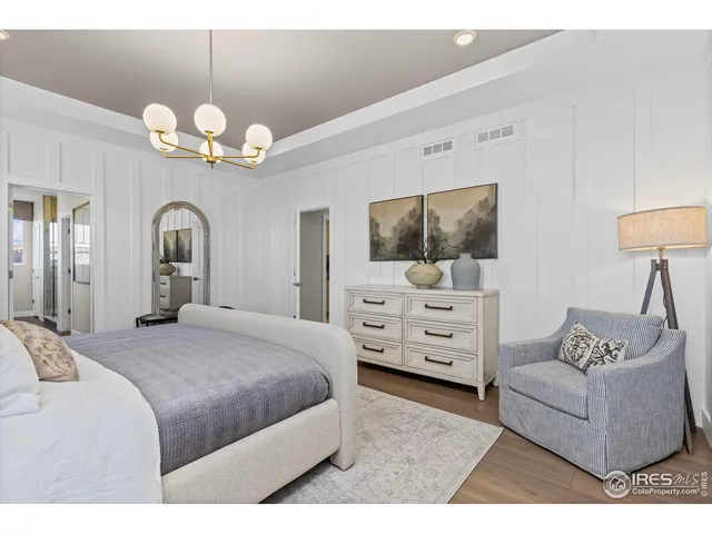 a kitchen with granite countertop white cabinets and sink