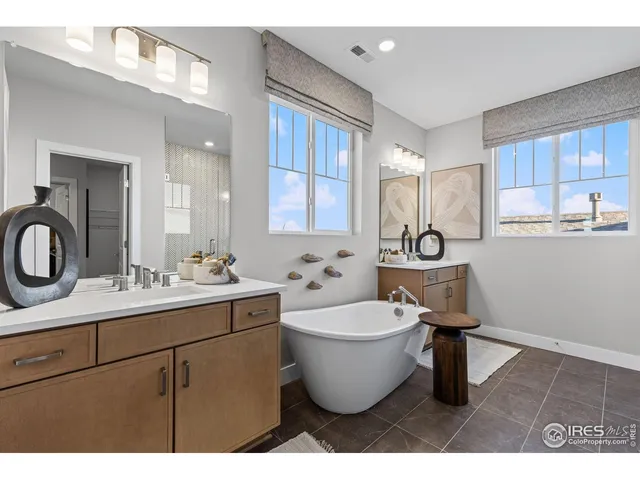 a kitchen with furniture wooden floor and white appliances