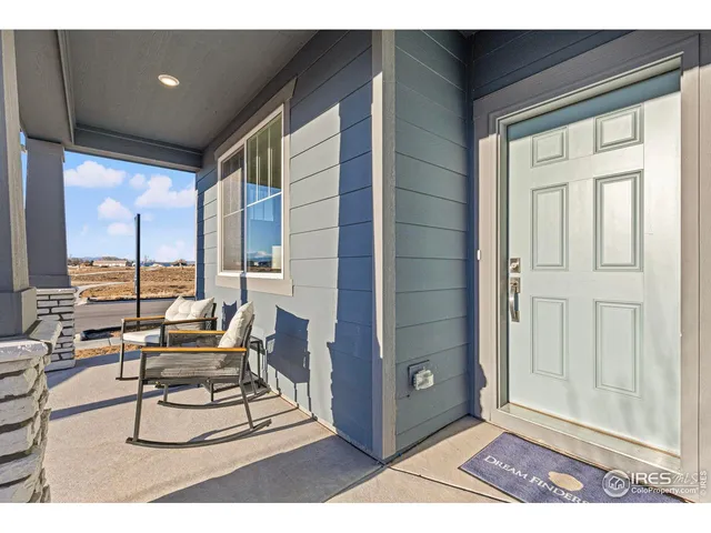 a spacious bathroom with a double vanity sink a mirror and a bathtub