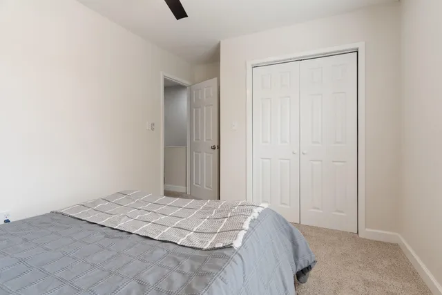 a bedroom with a bed and a shower