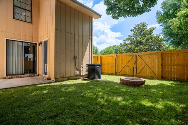 a backyard of a house with lots of green space