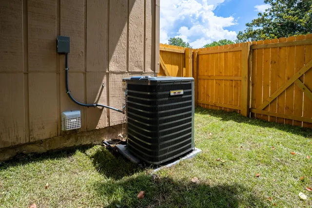 a backyard of a house with wooden fence