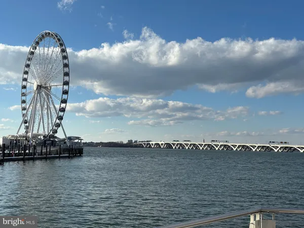 a view of swimming pool with outdoor seating