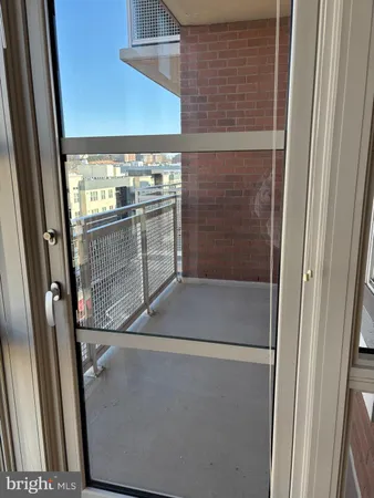 a bathroom with a glass door shower and door