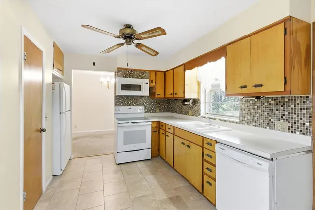 a view of a kitchen with a sink