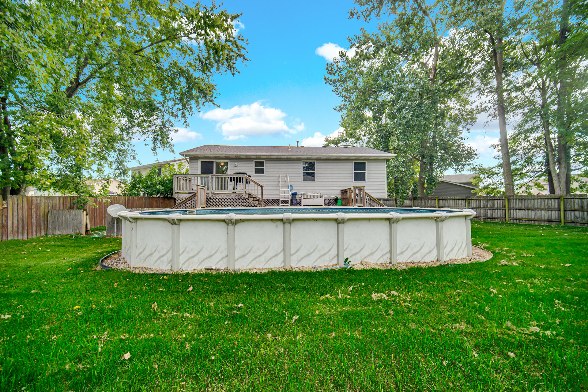 3716 Walsh Street Portage, IN 46368 - Photo 23 of 24 a view of a house with a swimming pool and a big yard