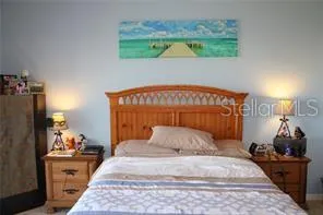 a room with a bed and cabinet