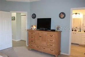 a bathroom with a sink a toilet and a window