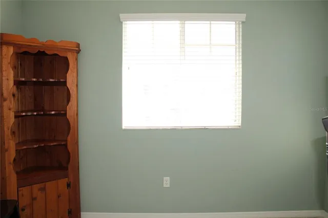 a view of a house with pool and deck