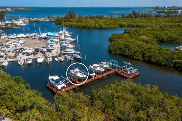 a kitchen with granite countertop white cabinets and black appliances