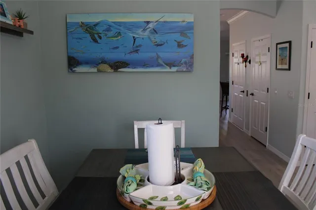 a living room with furniture a flat screen tv and a window