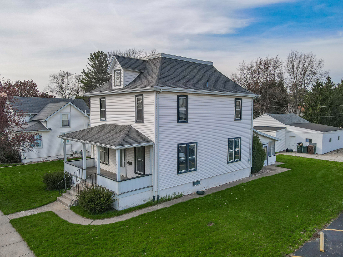 141 West 1st Street Manteno, IL 60950 - Photo 2 of 16 a front view of a house with a yard