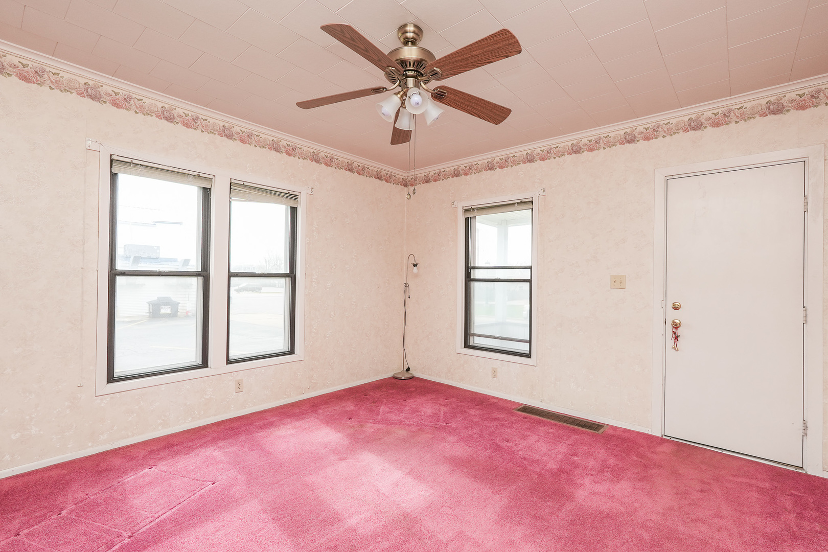 141 West 1st Street Manteno, IL 60950 - Photo 7 of 16 an empty room with windows and fan