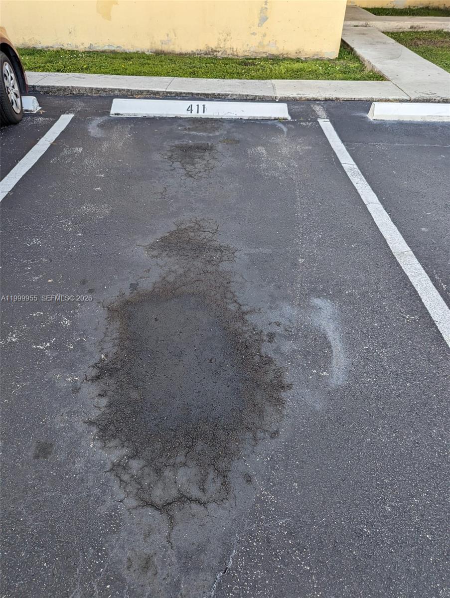 7360 Southwest 82nd Street, Unit E202 Miami, FL 33143 - Photo 11 of 11 a view of a road with a road