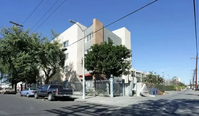 a view of street with parked cars
