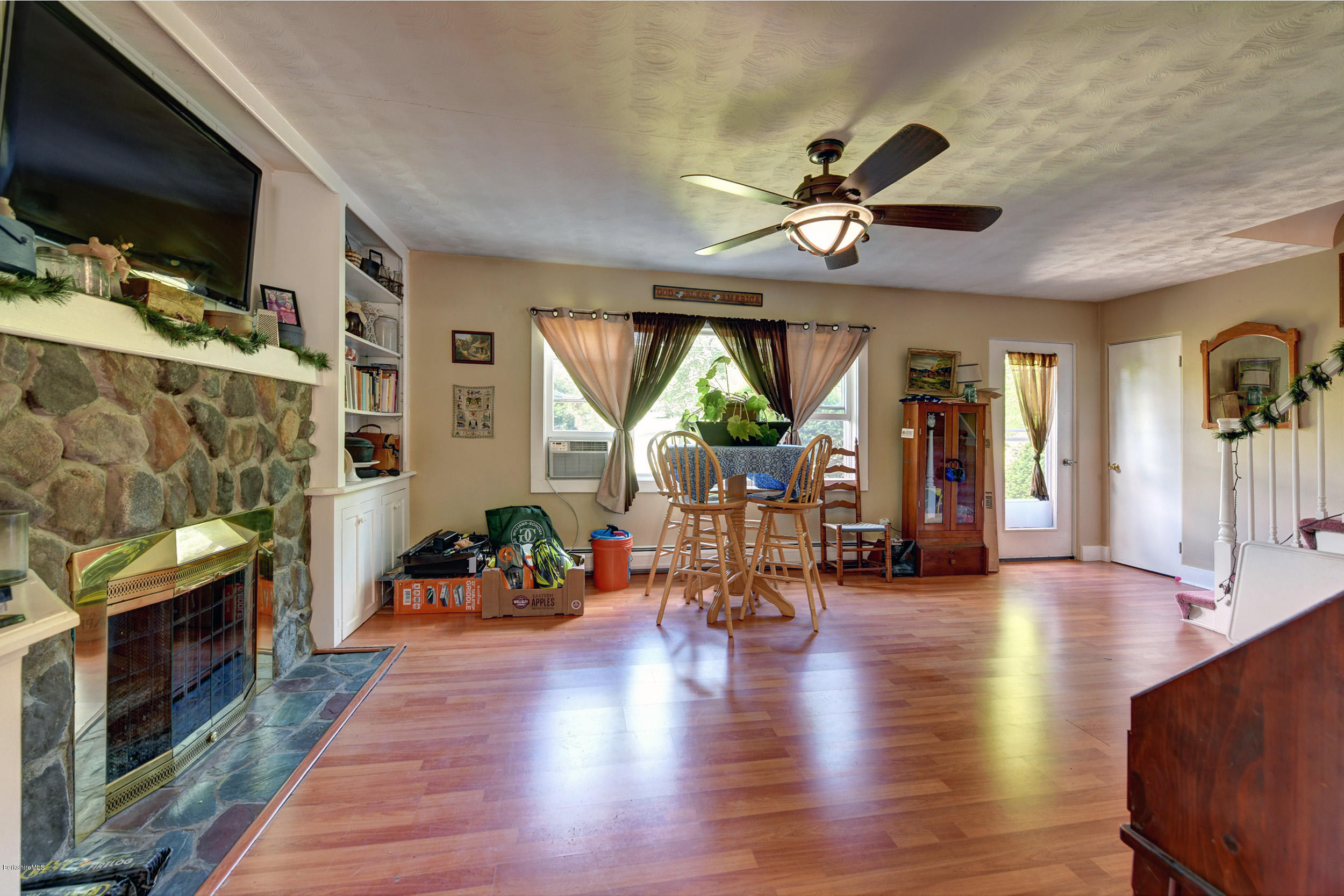 2175 Swamp Road Richmond, MA 01254 - Photo 13 of 33 a view of a livingroom with furniture hardwood floor and a ceiling fan
