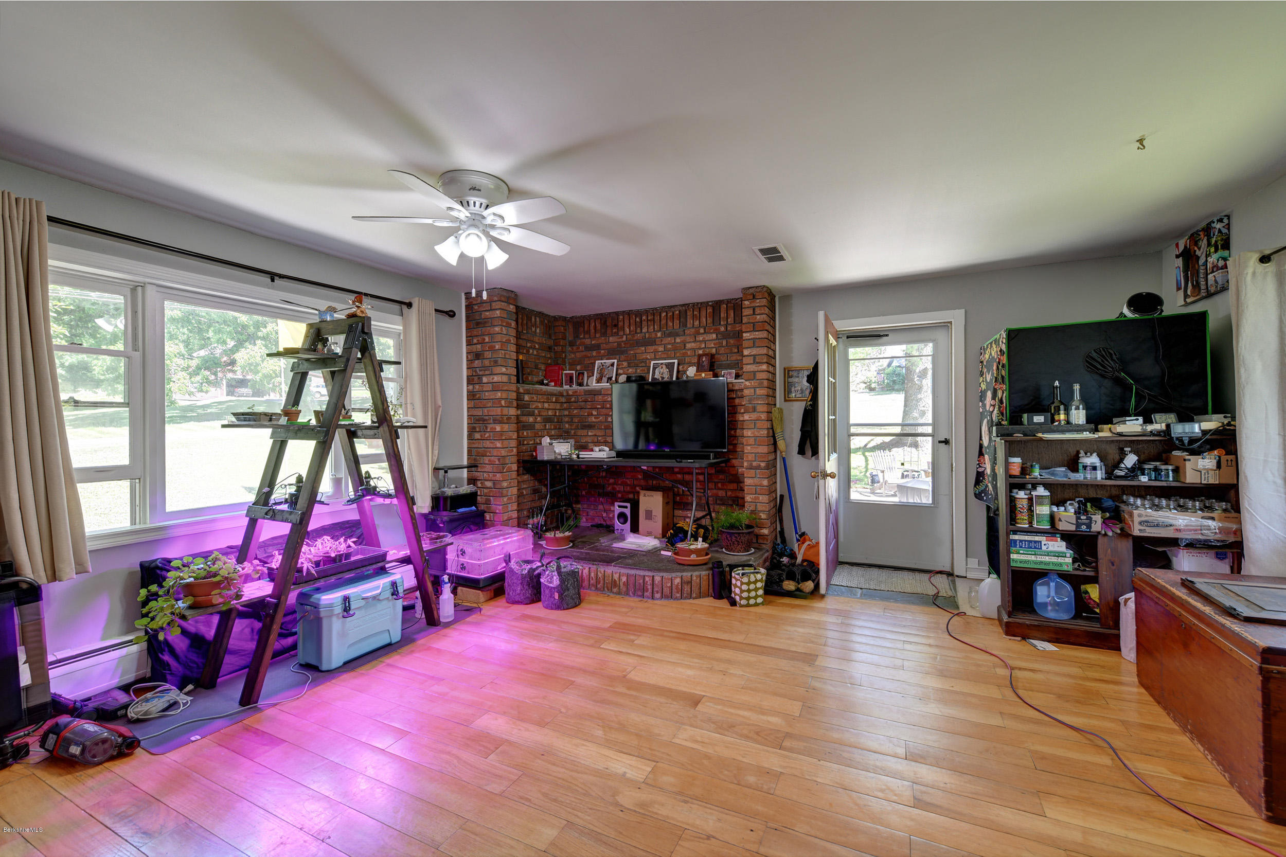 2175 Swamp Road Richmond, MA 01254 - Photo 23 of 33 a living room with furniture flat screen tv and a large window