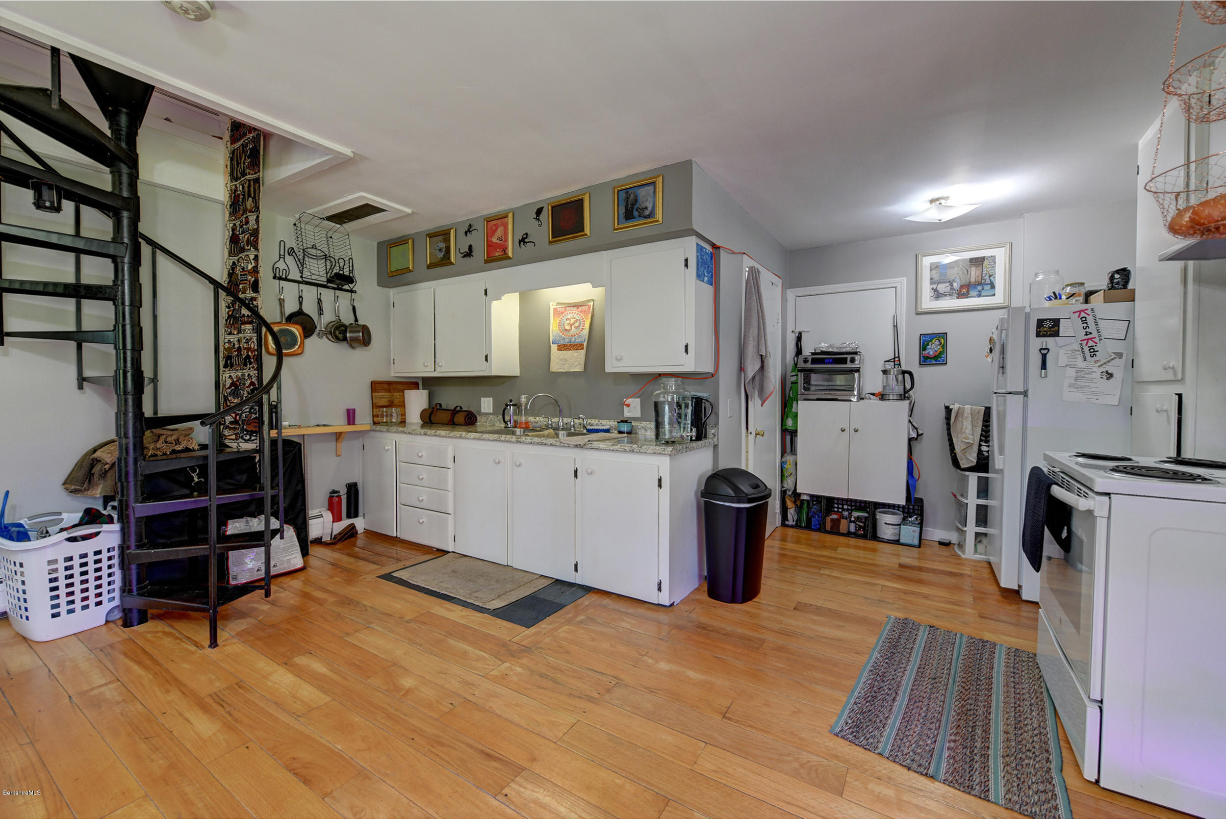 2175 Swamp Road Richmond, MA 01254 - Photo 24 of 33 a kitchen with stainless steel appliances kitchen island granite countertop a refrigerator and a sink