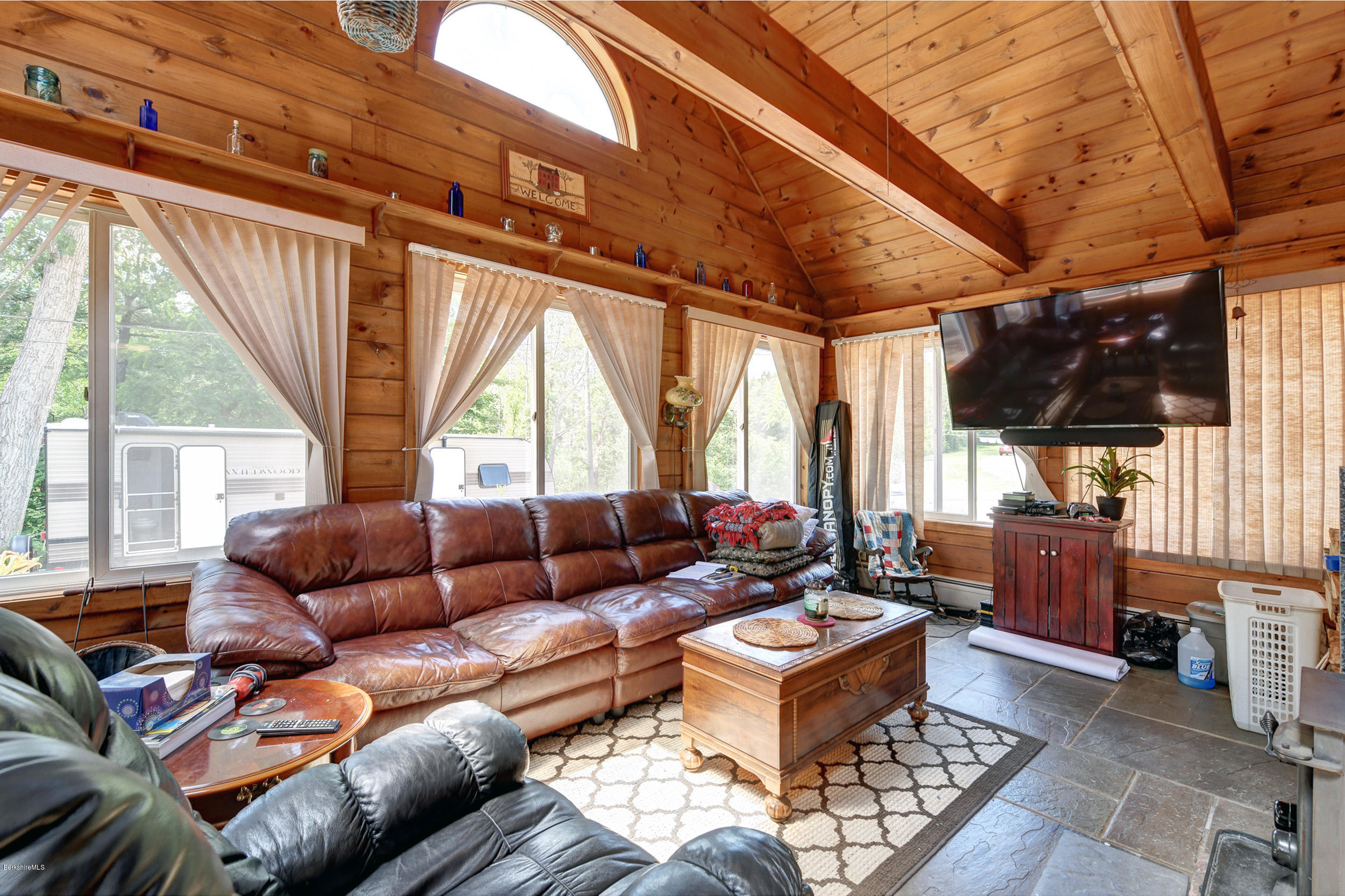 2175 Swamp Road Richmond, MA 01254 - Photo 7 of 33 a living room with furniture a large window and a rug