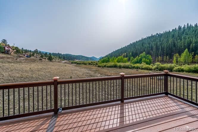 202 Wilkins Road Bailey, CO 80421 - Photo 3 of 40 a view of balcony with wooden floor