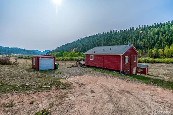 202 Wilkins Road Bailey, CO 80421 - Photo 5 of 40 a pathway of a house with a yard