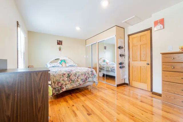 a bedroom with a bed and a view of bathroom
