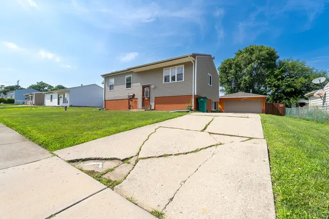 a backyard of a house with yard and barbeque oven
