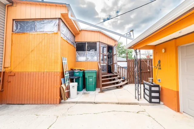 a view of a chairs and table in a patio