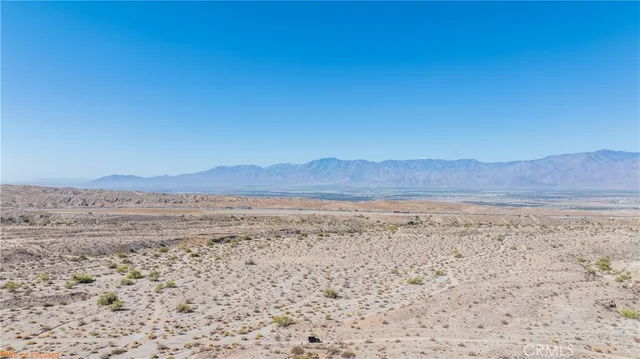 a view of ocean and mountain