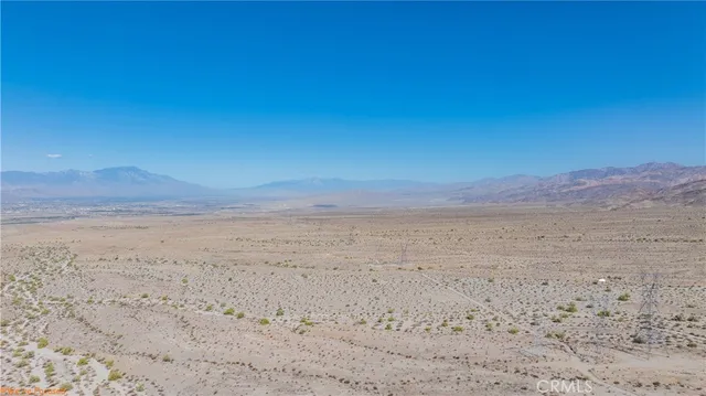 a view of beach and mountain