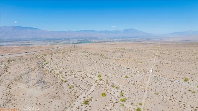 a view of beach and a mountain
