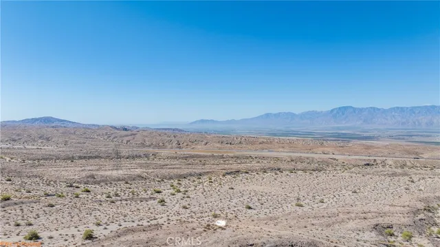 a view of ocean with a mountain