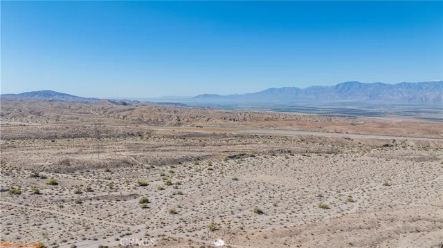 a view of ocean with a mountain