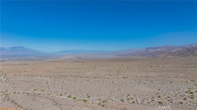 a view of beach and mountain