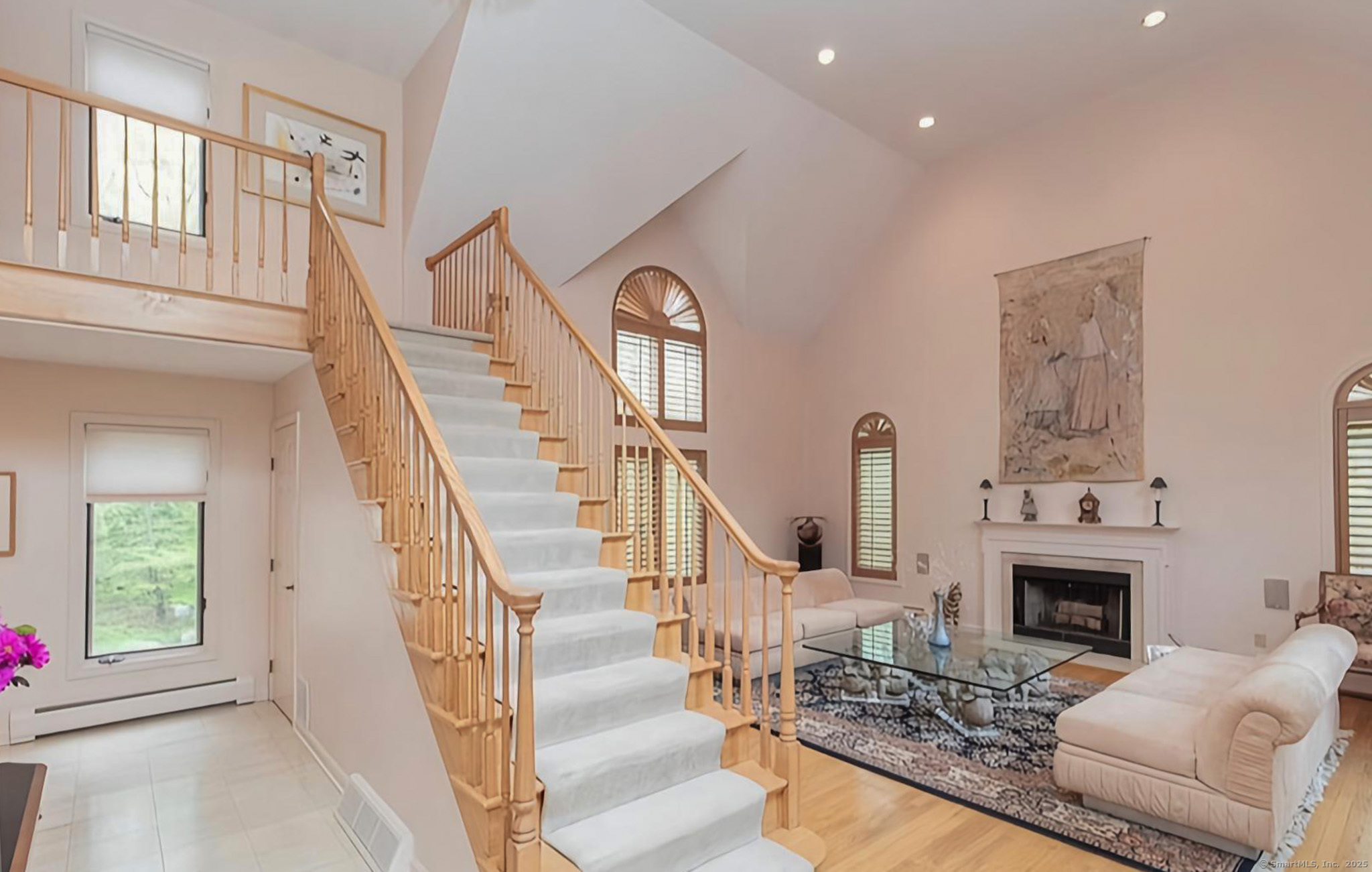 7 Canterbury Lane Monroe, CT 06468 - Photo 1 of 1 a living room with furniture a fireplace and a potted plant