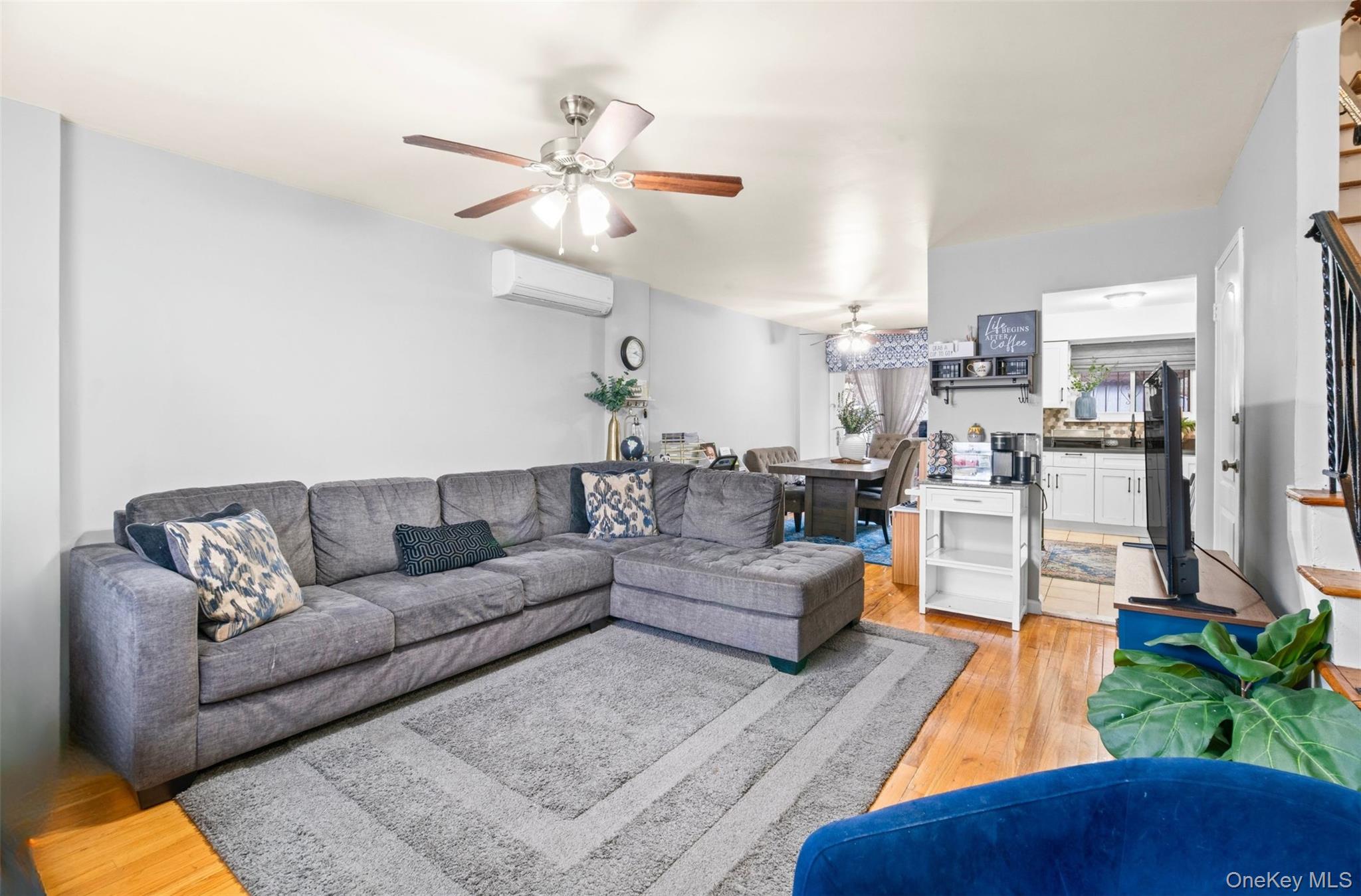 113-34 Springfield Boulevard Queens, NY 11429 - Photo 4 of 26 a living room with furniture and a view of kitchen