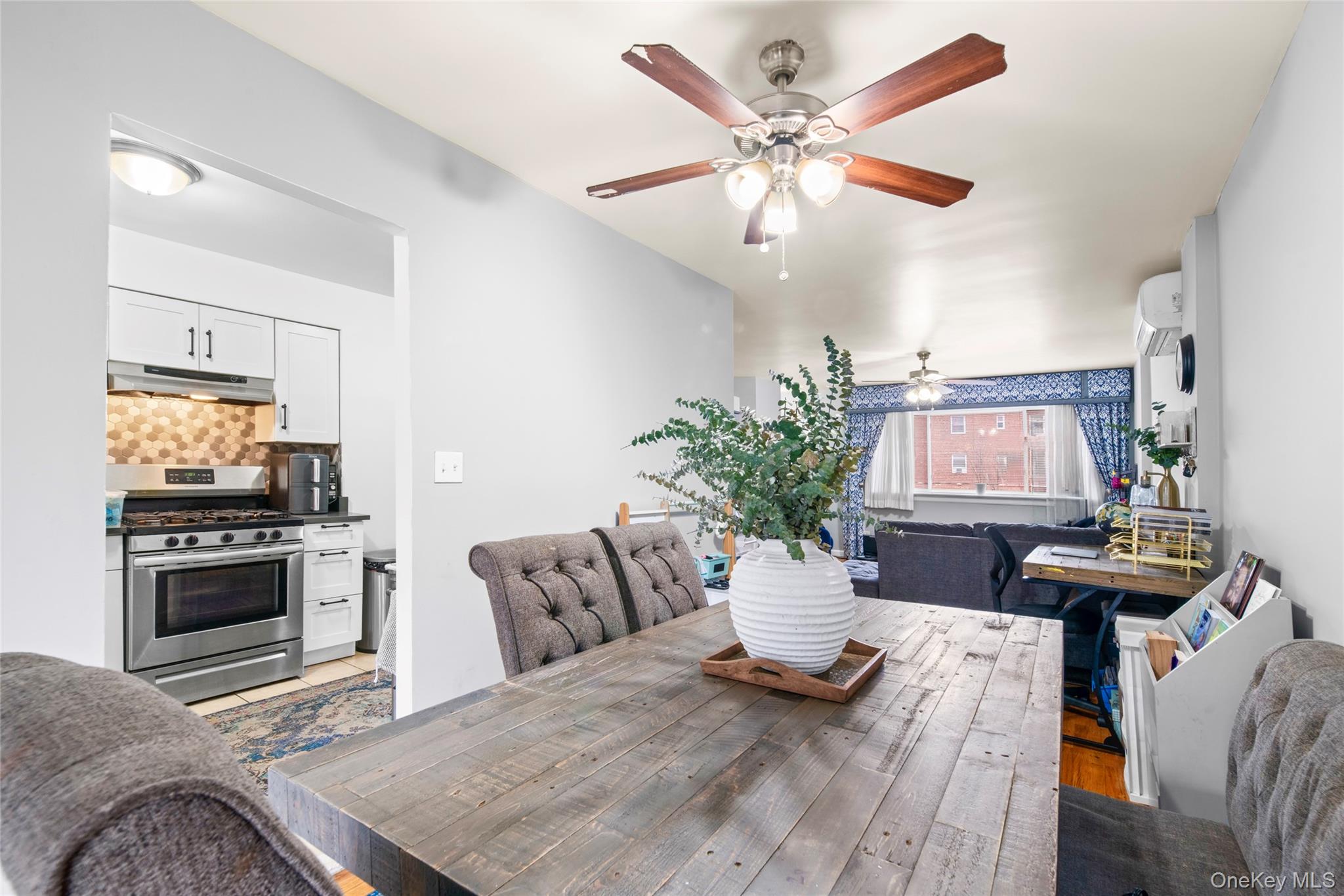 113-34 Springfield Boulevard Queens, NY 11429 - Photo 6 of 26 a living room with furniture and fireplace