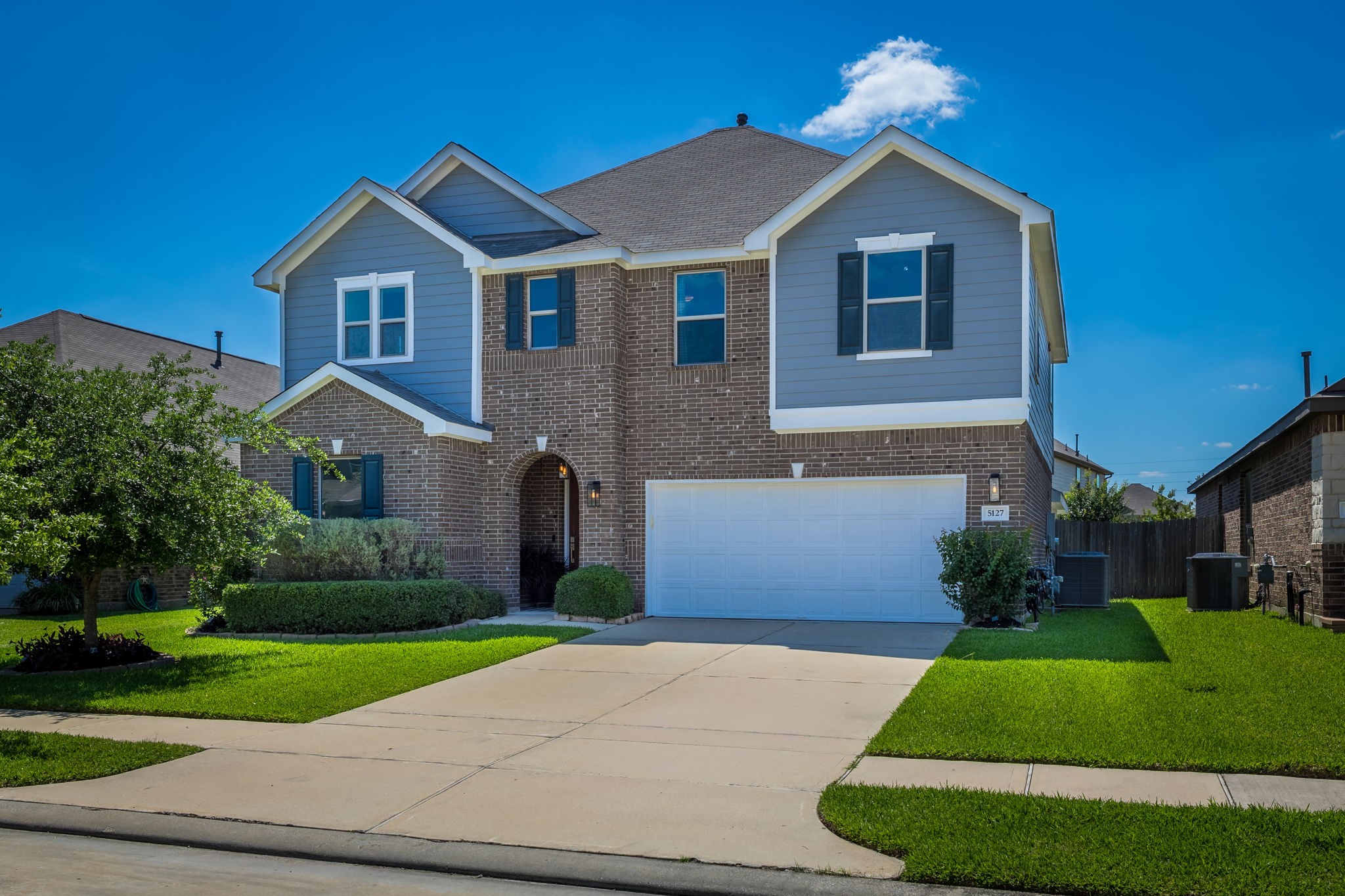 5127 Avondale Rise Street Katy, TX 77493 - Photo 2 of 47 a front view of a house with a yard