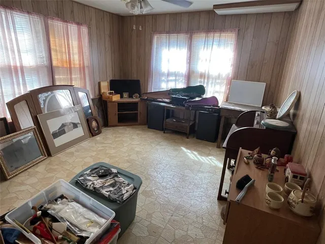 a bedroom with furniture and a window