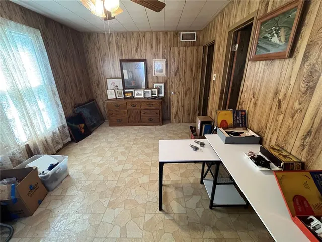a room with furniture and a flat screen tv