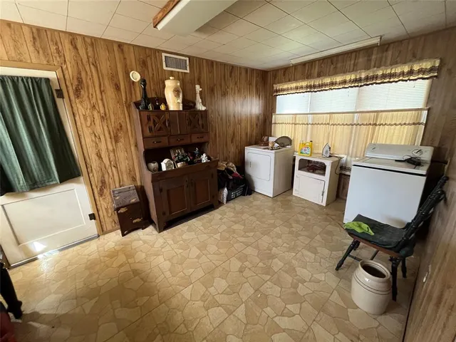 a bed room with a bed and a window