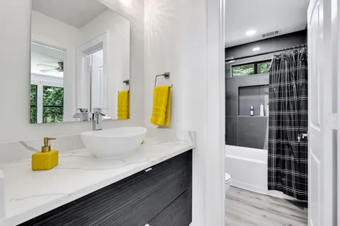 a bathroom with a sink and a shower